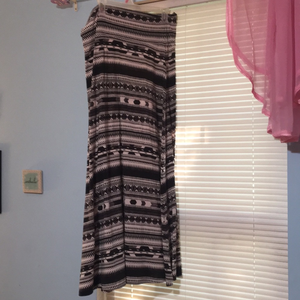 Floor length black and white skirt.
